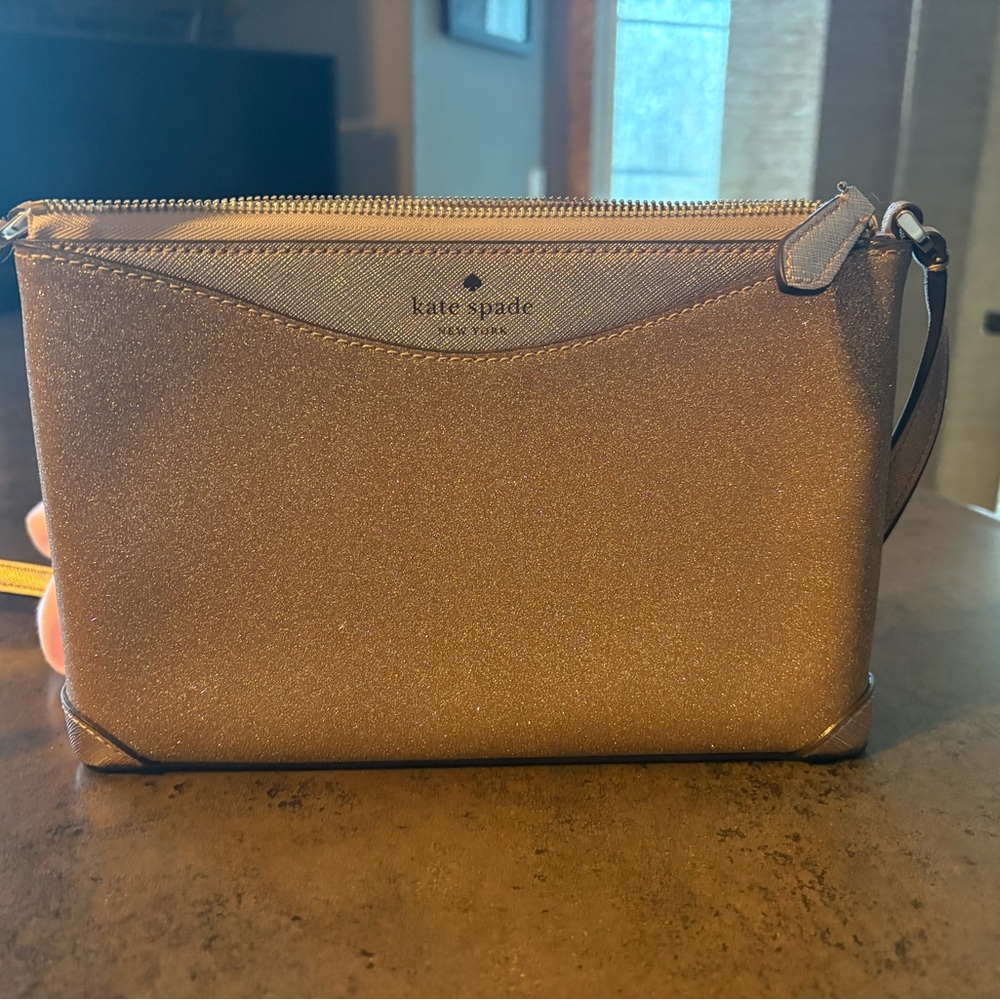 Kate Spade Glittering punk- silver bag.
Comes with matching card case/wallet.